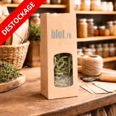 Sac SOS kraft brun avec fenêtre en présentation boutique contenant des herbes séchées.