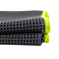 Gros plan sur la texture nid d’abeille d’un torchon microfibre professionnel