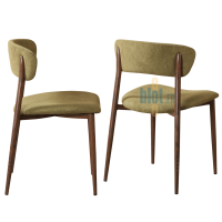 Chaise JULIA vert olive présentée de profil et de trois quarts arrière, avec assise garnie et dossier arrondi
